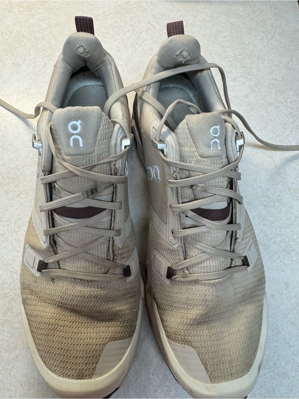 On Running women’s trail shoes in beige and brown